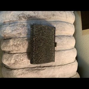 INC clutch with strap